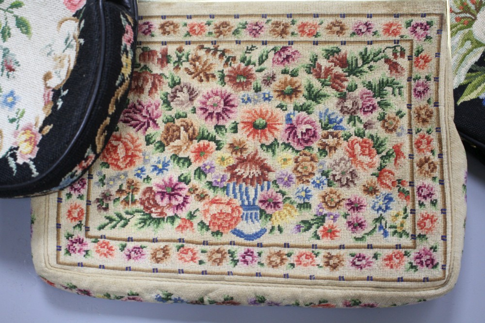 A collection of assorted vintage bags and evening purses